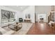 Inviting living room with hardwood floors, a large window, and an open layout, perfect for entertaining at 8424 E Otero Cir, Centennial, CO 80112