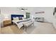 Bright main bedroom with a stylish bed, sofa, large window, and a ceiling fan at 8424 E Otero Cir, Centennial, CO 80112