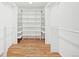 Walk-in closet with wooden floor and tons of shelving at 8424 E Otero Cir, Centennial, CO 80112
