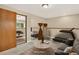 Finished basement showcasing a workout area, a cozy living space, and carpet flooring; virtually staged at 18445 W 59Th Dr, Golden, CO 80403