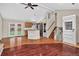 Open-concept layout with hardwood floors and a seamless transition from the living area to the kitchen and backyard at 18445 W 59Th Dr, Golden, CO 80403