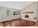 Bright and airy living room with a tiled fireplace and a bay window providing lots of natural light at 18445 W 59Th Dr, Golden, CO 80403