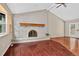 Inviting living room with a stone fireplace, hardwood floors, and access to the back patio at 18445 W 59Th Dr, Golden, CO 80403