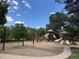 Community playground offering swings, slides, and climbing structures for to enjoy a playful day at 18445 W 59Th Dr, Golden, CO 80403