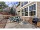 Charming back patio with outdoor seating, grill, and views of the landscaped backyard at 4810 Mountain Gold Run, Broomfield, CO 80023