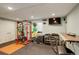 Basement gym with a variety of exercise equipment and a large TV at 4810 Mountain Gold Run, Broomfield, CO 80023