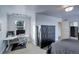 Bedroom with built in work area, dark wood furniture, neutral carpet and decor, and great natural light at 4810 Mountain Gold Run, Broomfield, CO 80023