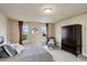 Comfortable bedroom features neutral tones, soft carpet, and plenty of natural light at 4810 Mountain Gold Run, Broomfield, CO 80023