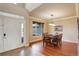 Dining room with hardwood floors, natural light, and an elegant chandelier at 4810 Mountain Gold Run, Broomfield, CO 80023