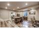 Basement game room has a long table, chairs, and wood flooring at 4810 Mountain Gold Run, Broomfield, CO 80023