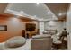 Inviting living room with a large TV, leather seating, and neutral walls, perfect for entertaining at 4810 Mountain Gold Run, Broomfield, CO 80023
