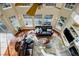 Overhead view of the living room featuring a fireplace and tall bright windows at 4810 Mountain Gold Run, Broomfield, CO 80023