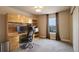 Office features built-in desk and cabinets and a neutral carpet at 4810 Mountain Gold Run, Broomfield, CO 80023