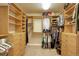 Large walk-in closet with custom shelving and storage solutions at 4810 Mountain Gold Run, Broomfield, CO 80023