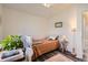 Bright bedroom with vaulted ceilings, a comfortable bed, and natural light at 5075 Garrison St # 3, Wheat Ridge, CO 80033