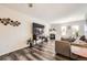 Bright, spacious living room featuring fireplace, updated flooring, and large windows at 5075 Garrison St # 3, Wheat Ridge, CO 80033