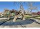 Community playground offering children a great place to play, surrounded by mature trees at 5075 Garrison St # 3, Wheat Ridge, CO 80033