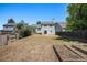 Large backyard with garden beds and a privacy fence, offering ample space at 19876 E Brunswick Dr, Aurora, CO 80013