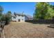 Expansive backyard featuring a spacious lawn, mature trees, and a wooden fence at 19876 E Brunswick Dr, Aurora, CO 80013