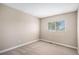 This bedroom features plush carpet flooring, window with blinds, and neutral wall paint at 19876 E Brunswick Dr, Aurora, CO 80013