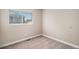 This bedroom features plush carpet flooring, window with blinds, and neutral wall paint at 19876 E Brunswick Dr, Aurora, CO 80013