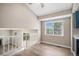 The living room offers light wood floors, high ceilings, a large window, and staircase to the second level at 19876 E Brunswick Dr, Aurora, CO 80013
