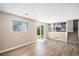 This living room features hardwood floors and a sliding glass door to the backyard at 19876 E Brunswick Dr, Aurora, CO 80013