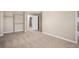 The spacious bedroom is carpeted, and includes a closet with a doorway to the bathroom at 19876 E Brunswick Dr, Aurora, CO 80013