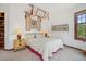 Inviting bedroom featuring soft lighting, a canopy over the bed, and warm color tones at 6767 Timbers Dr, Evergreen, CO 80439