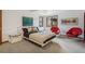 Inviting bedroom featuring stylish decor, an abundance of natural light, and comfortable furnishings at 6767 Timbers Dr, Evergreen, CO 80439