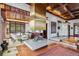 Chic dining room featuring a modern fireplace, mountain views, and a custom wood ceiling at 6767 Timbers Dr, Evergreen, CO 80439