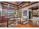 Grand entryway boasting a custom wood ceiling, open floor plan, and an amazing mountain view at 6767 Timbers Dr, Evergreen, CO 80439