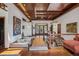 Elegant foyer featuring a custom wood ceiling, open floor plan, and unique architectural elements at 6767 Timbers Dr, Evergreen, CO 80439