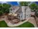 Back of home from above showcasing its deck, landscaping, and proximity to trees for outdoor enjoyment at 6255 Collegiate Dr, Highlands Ranch, CO 80130