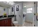 Bathroom and laundry area featuring a modern vanity and washer and dryer at 6255 Collegiate Dr, Highlands Ranch, CO 80130
