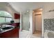 Bright bathroom features modern fixtures, glass enclosed shower, and tiled accents at 6255 Collegiate Dr, Highlands Ranch, CO 80130
