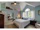 Bright bedroom with vaulted ceiling, large windows, and mirrored closet doors at 6255 Collegiate Dr, Highlands Ranch, CO 80130