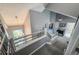 Hallway showing view of the home's high ceilings, railing, and chandelier at 6255 Collegiate Dr, Highlands Ranch, CO 80130