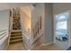 Hallway featuring a staircase, and a view of a bedroom at 6255 Collegiate Dr, Highlands Ranch, CO 80130