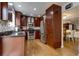 Updated kitchen featuring stainless steel appliances, granite countertops, and hardwood floors at 6255 Collegiate Dr, Highlands Ranch, CO 80130