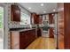 This kitchen features granite countertops, stainless steel appliances, and custom cabinets at 6255 Collegiate Dr, Highlands Ranch, CO 80130