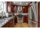 Updated kitchen featuring stainless steel appliances, granite countertops, and custom cabinets at 6255 Collegiate Dr, Highlands Ranch, CO 80130