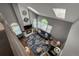 Bright living room with high ceilings, skylights, fireplace, and large windows at 6255 Collegiate Dr, Highlands Ranch, CO 80130