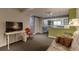 Cozy living room featuring carpet, comfortable seating, and natural light perfect for relaxation at 6255 Collegiate Dr, Highlands Ranch, CO 80130