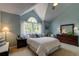 Bedroom with vaulted ceilings and large windows creates a serene atmosphere at 6255 Collegiate Dr, Highlands Ranch, CO 80130