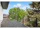 Spacious balcony shows the open-air area with a view of the neighborhood and surrounding greenery at 2391 King St, Denver, CO 80211