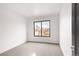 Bright bedroom with a large window, neutral carpet, and fresh, airy feel at 2391 King St, Denver, CO 80211