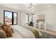 Bright bedroom featuring large windows, stylish furnishings, and minimalist decor at 2391 King St, Denver, CO 80211