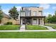 Contemporary home featuring a rooftop deck and well-manicured lawn at 2391 King St, Denver, CO 80211