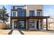 Modern home exterior featuring clean lines, a combination of brick and siding, and inviting curb appeal at 2391 King St, Denver, CO 80211